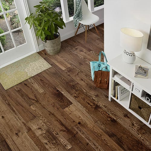 Rustic hardwood floor in a room with an older, handmade look