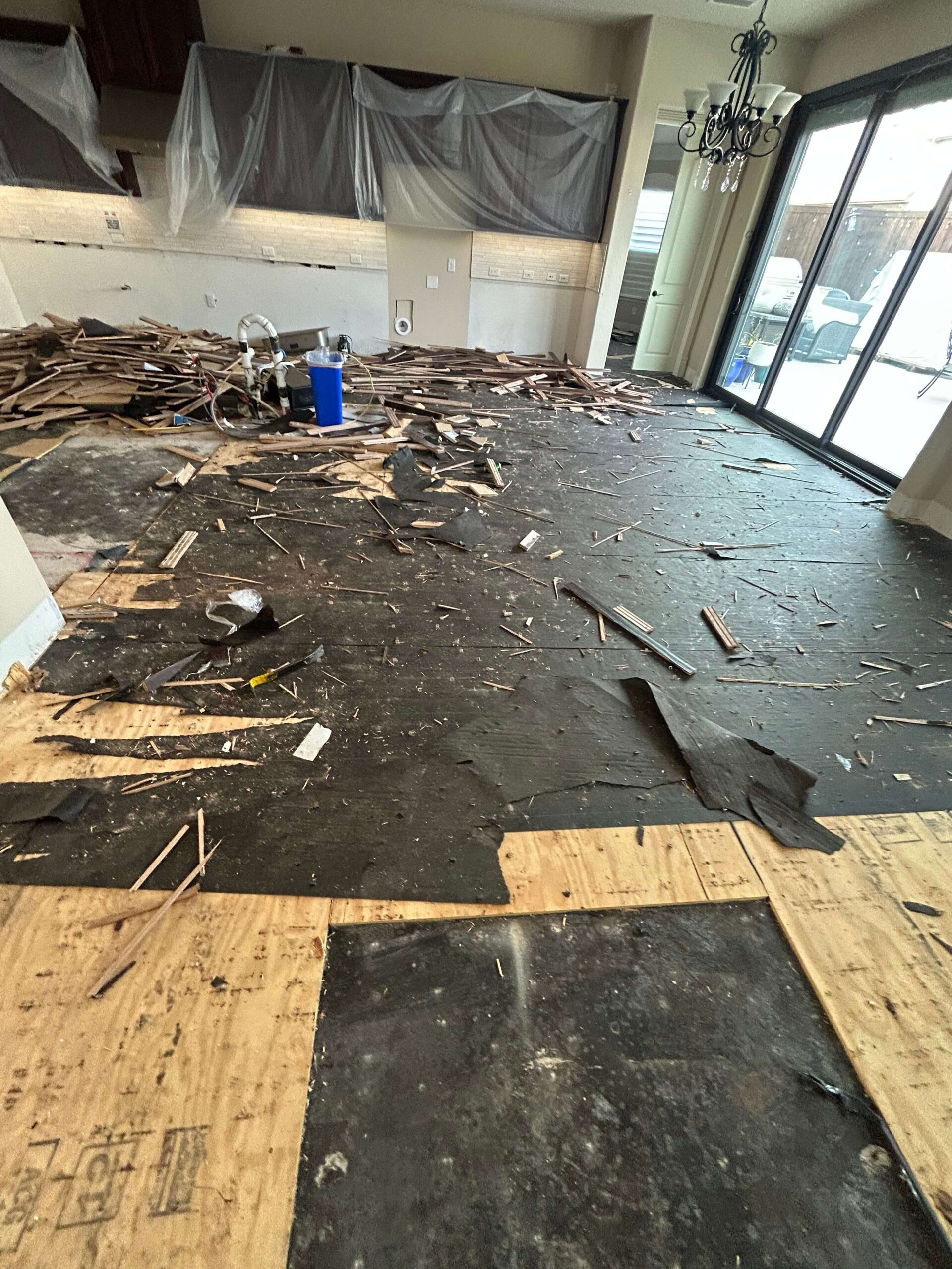 Water damaged solid hardwood flooring demolished for replacement