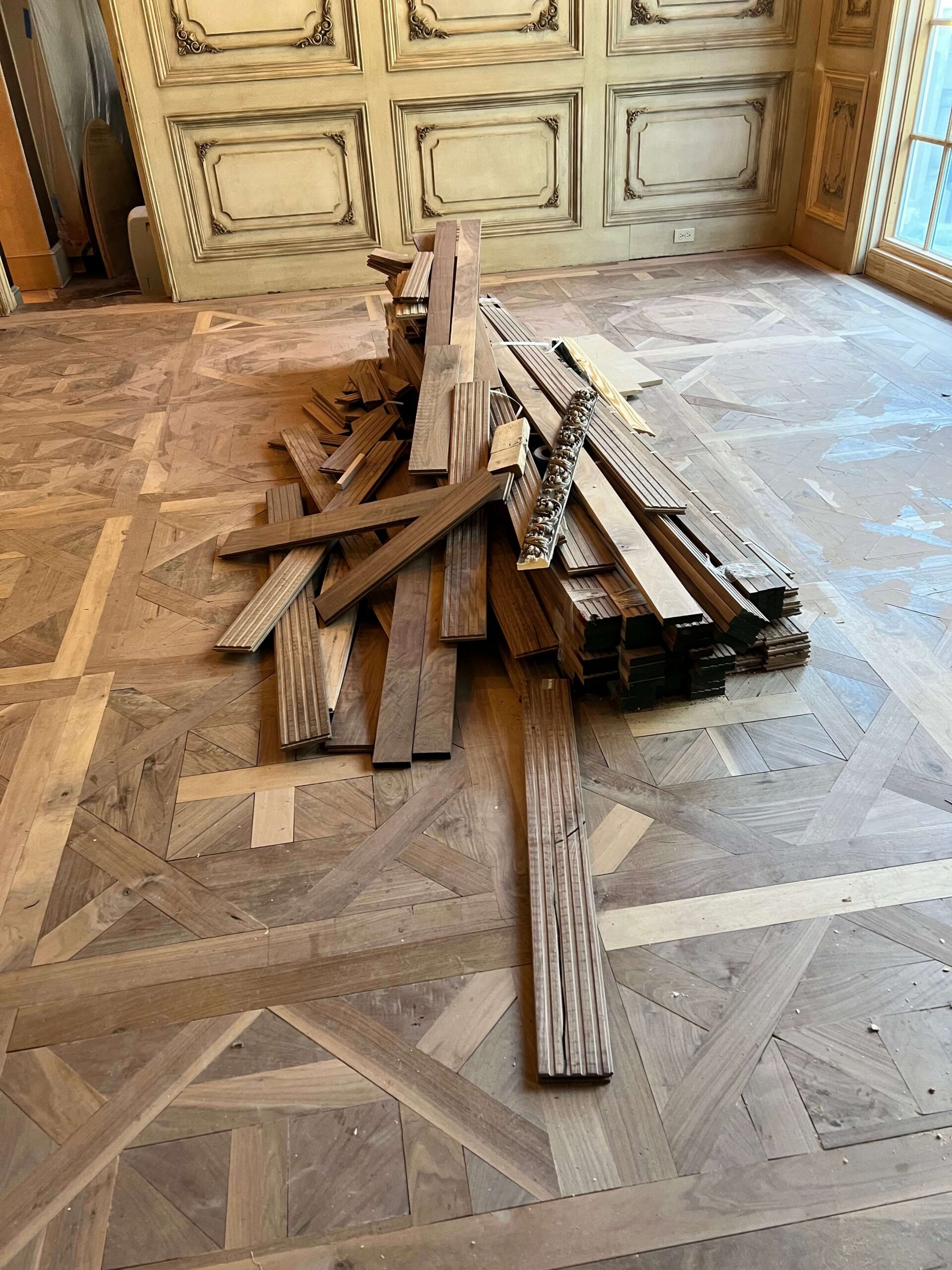 Finished hardwood floor after a water damaged section was replaced
